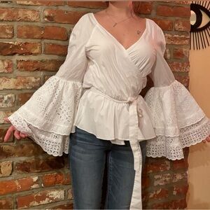 Rebecca Minkoff “Melly” top with belle sleeve and a wrap silhouette.